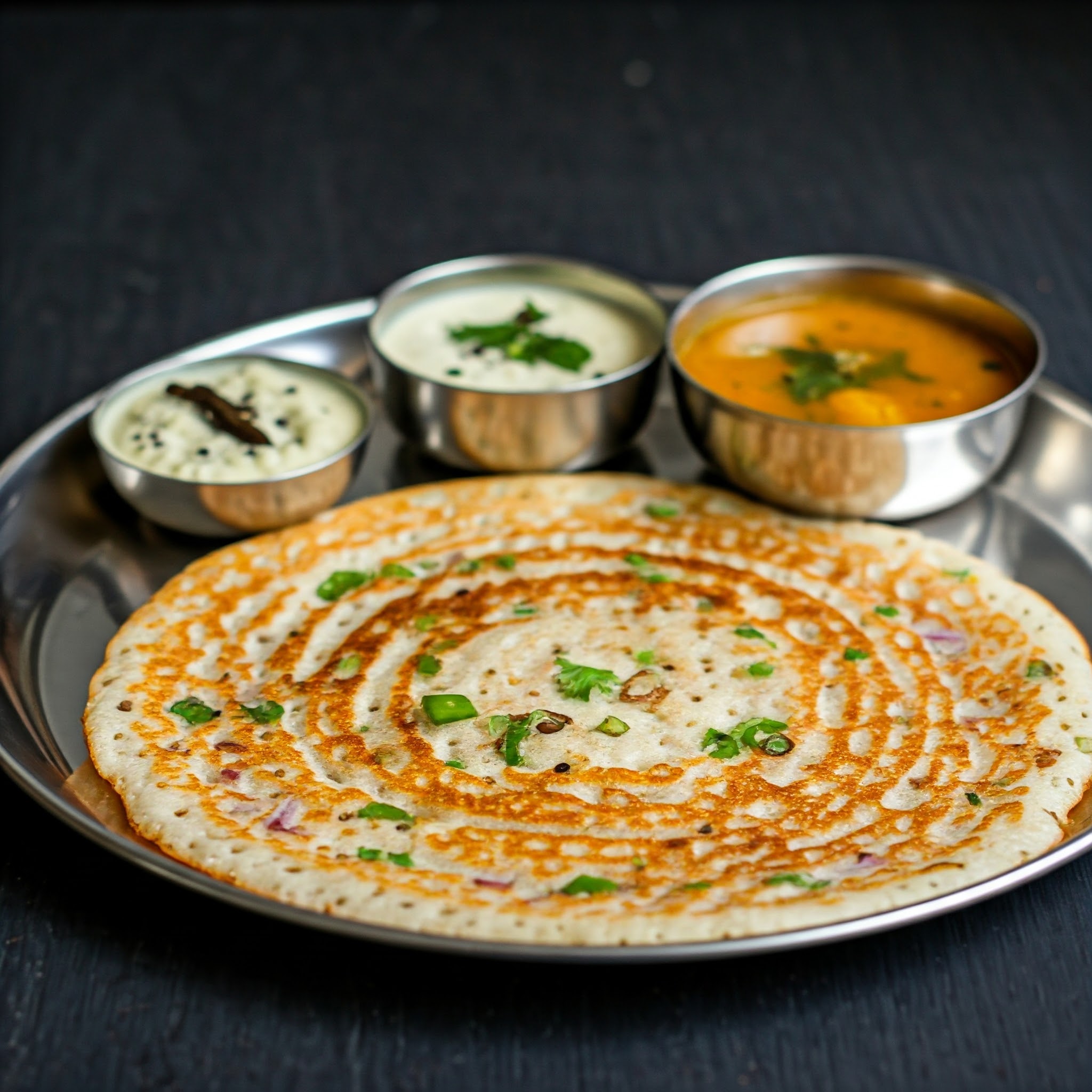 Golden-brown onion semolina crepes, crispy edges with a savoury filling.